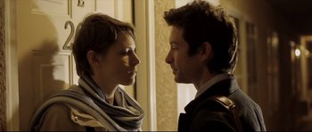 Movie still from “Upstream Color” (2013), directed by Shane Carruth – A man and a woman looking at each other in front of a window; Close Up shot, Over the shoulder angle