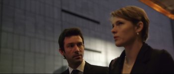 Movie still from “Upstream Color” (2013), directed by Shane Carruth – A man and a woman standing next to each other; Close Up shot, Low angle