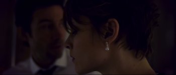 Movie still from “Upstream Color” (2013), directed by Shane Carruth – A person wearing a earring; Close Up shot, Over the shoulder angle