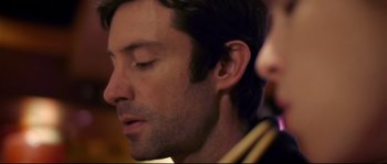 Movie still from “Upstream Color” (2013), directed by Shane Carruth – A person with his eyes closed; Close Up shot, Low angle