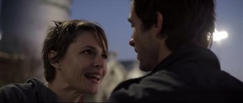Movie still from “Upstream Color” (2013), directed by Shane Carruth – A man and a woman smiling at each other; Close Up shot, Over the shoulder angle