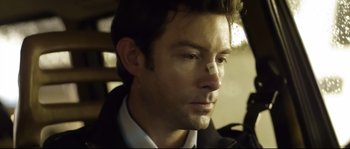 Movie still from “Upstream Color” (2013), directed by Shane Carruth – A person with a bandage on his face; Close Up shot, Over the shoulder angle