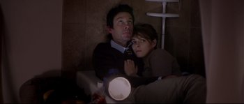 Movie still from “Upstream Color” (2013), directed by Shane Carruth – A man and a woman sitting next to each other; Medium shot, Overhead angle