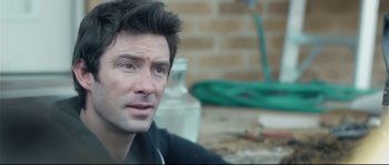 Movie still from “Upstream Color” (2013), directed by Shane Carruth – A person sitting at a table; Close Up shot, Over the shoulder angle