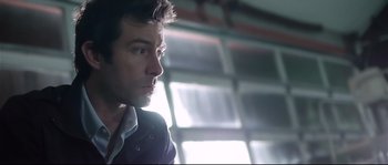 Movie still from “Upstream Color” (2013), directed by Shane Carruth – A person wearing a jacket; Close Up shot, Low angle