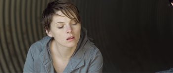Movie still from “Upstream Color” (2013), directed by Shane Carruth – A person with her eyes closed; Close Up shot, Low angle