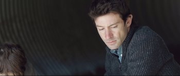 Movie still from “Upstream Color” (2013), directed by Shane Carruth – A person with his eyes closed; Close Up shot, Low angle