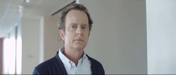 Movie still from “Upstream Color” (2013), directed by Shane Carruth – A person wearing a shirt and jacket; Close Up shot, Low angle