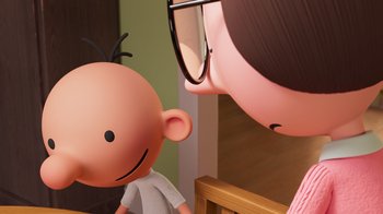 Movie still from “Diary of a Wimpy Kid” (2021), directed by Gino Nichele – A cartoon of a boy and a girl with glasses; Close Up shot, Over the shoulder angle