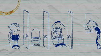 Movie still from “Diary of a Wimpy Kid” (2021), directed by Gino Nichele – A man sitting in a bathroom with a toilet in front of him; Wide shot, Overhead angle