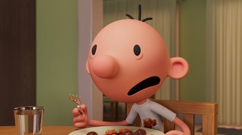 Movie still from “Diary of a Wimpy Kid” (2021), directed by Gino Nichele – An animated character sitting in front of a plate of food; Close Up shot, High angle
