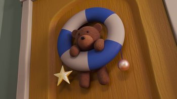 Movie still from “Diary of a Wimpy Kid” (2021), directed by Gino Nichele – A brown teddy bear sitting on top of a wooden table; Extreme Close Up shot, Overhead angle