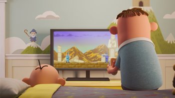 Movie still from “Diary of a Wimpy Kid” (2021), directed by Gino Nichele – A man and a woman are playing a video game; Wide shot, Over the shoulder angle