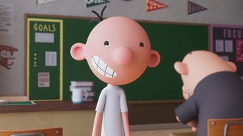 Movie still from “Diary of a Wimpy Kid” (2021), directed by Gino Nichele – A cartoon character with a big smile on his face; Close Up shot, Over the shoulder angle