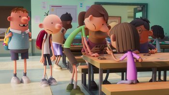 Movie still from “Diary of a Wimpy Kid” (2021), directed by Gino Nichele – A group of kids sitting at a table in a classroom; Wide shot, Over the shoulder angle