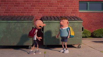 Movie still from “Diary of a Wimpy Kid” (2021), directed by Gino Nichele – A couple of people standing next to each other on a sidewalk; Wide shot, Low angle