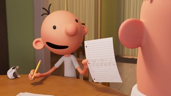 Movie still from “Diary of a Wimpy Kid” (2021), directed by Gino Nichele – A cartoon character holding a pencil and a piece of paper in front of him; Medium shot, Over the shoulder angle