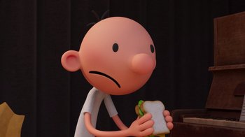 Movie still from “Diary of a Wimpy Kid” (2021), directed by Gino Nichele – A cartoon character holding a hot dog in his hand; Close Up shot, Low angle