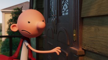 Movie still from “Diary of a Wimpy Kid” (2021), directed by Gino Nichele – A cartoon of a man standing in front of an open door; Extreme Close Up shot, Over the shoulder angle
