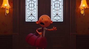 Movie still from “Diary of a Wimpy Kid” (2021), directed by Gino Nichele – A cartoon character holding a red bag in front of a window; Medium shot, High angle