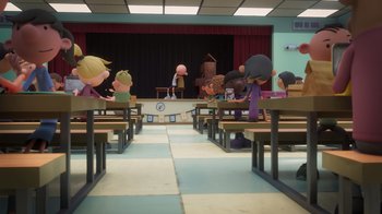 Movie still from “Diary of a Wimpy Kid” (2021), directed by Gino Nichele – A group of children sitting at a table in front of a stage; Extreme Wide shot, High angle