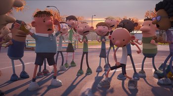 Movie still from “Diary of a Wimpy Kid” (2021), directed by Gino Nichele – A group of people standing in a parking lot; Wide shot, High angle