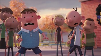 Movie still from “Diary of a Wimpy Kid” (2021), directed by Gino Nichele – A group of people standing next to each other on a street; Medium shot, Over the shoulder angle