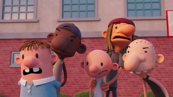 Movie still from “Diary of a Wimpy Kid” (2021), directed by Gino Nichele – A group of cartoon characters standing next to each other in front of a brick building; Medium shot, Low angle