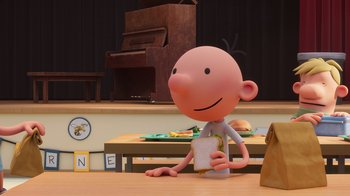 Movie still from “Diary of a Wimpy Kid” (2021), directed by Gino Nichele – A cartoon character is sitting at a table; Medium shot, Over the shoulder angle