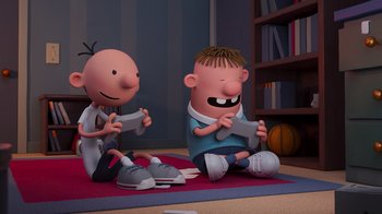 Movie still from “Diary of a Wimpy Kid” (2021), directed by Gino Nichele – A couple of people sitting on the ground; Medium shot, High angle