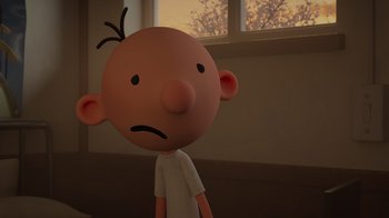 Movie still from “Diary of a Wimpy Kid: Rodrick Rules” (2022), directed by Gino Nichele – A cartoon character with a sad look on his face; Close Up shot, Over the shoulder angle