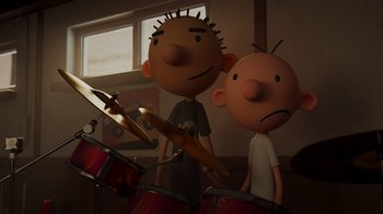 Movie still from “Diary of a Wimpy Kid: Rodrick Rules” (2022), directed by Gino Nichele – A couple of people that are playing drums; Medium shot, Over the shoulder angle