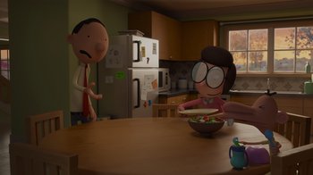 Movie still from “Diary of a Wimpy Kid: Rodrick Rules” (2022), directed by Gino Nichele – A person is eating a bowl of salad in a kitchen; Medium shot, Over the shoulder angle