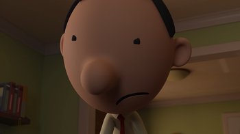 Movie still from “Diary of a Wimpy Kid: Rodrick Rules” (2022), directed by Gino Nichele – A cartoon of a man with a frowning face; Close Up shot, Low angle