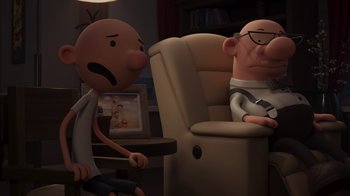 Movie still from “Diary of a Wimpy Kid: Rodrick Rules” (2022), directed by Gino Nichele – Two cartoon characters sitting in a living room; Wide shot, Over the shoulder angle