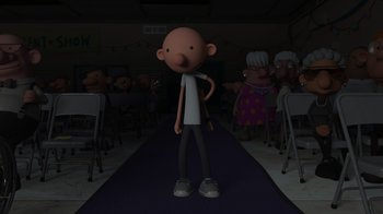 Movie still from “Diary of a Wimpy Kid: Rodrick Rules” (2022), directed by Gino Nichele – A cartoon of a man standing in front of an audience; Wide shot, High angle