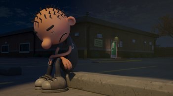 Movie still from “Diary of a Wimpy Kid: Rodrick Rules” (2022), directed by Gino Nichele – A cartoon character sitting on the curb of a street; Wide shot, High angle