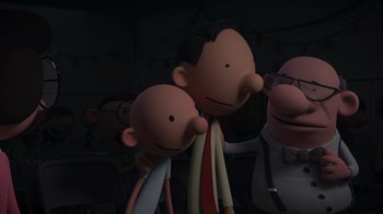 Movie still from “Diary of a Wimpy Kid: Rodrick Rules” (2022), directed by Gino Nichele – A group of people standing next to each other in a dark room; Medium shot, Over the shoulder angle