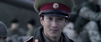 Movie still from “Die Another Day” (2002), directed by Lee Tamahori – A person wearing a hat; Close Up shot, Low angle