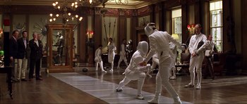 Movie still from “Die Another Day” (2002), directed by Lee Tamahori – A group of men in white fencing suits; Wide shot, Low angle