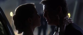 Movie still from “Die Another Day” (2002), directed by Lee Tamahori – A man and a woman face to face in the dark; Close Up shot, Low angle