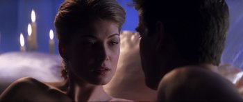 Movie still from “Die Another Day” (2002), directed by Lee Tamahori – A man and a woman face to face in the dark; Close Up shot, Over the shoulder angle