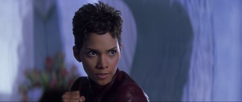 Movie still from “Die Another Day” (2002), directed by Lee Tamahori – A person wearing a leather jacket; Close Up shot, High angle