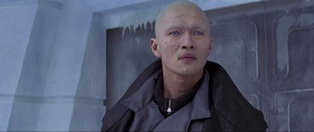 Movie still from “Die Another Day” (2002), directed by Lee Tamahori – A man with a shaved head and a bald head; Close Up shot, High angle