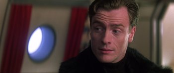 Movie still from “Die Another Day” (2002), directed by Lee Tamahori – A person wearing a black jacket; Close Up shot, Low angle