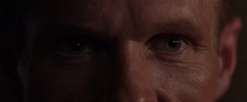 Movie still from “Die Hard 2” (1990), directed by Renny Harlin – A man's eyes in the dark; Extreme Close Up shot, Overhead angle