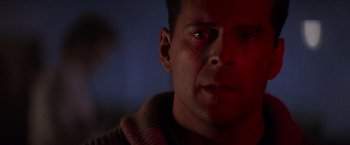 Movie still from “Die Hard 2” (1990), directed by Renny Harlin – A man's face in the dark; Close Up shot, Low angle