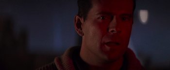 Movie still from “Die Hard 2” (1990), directed by Renny Harlin – A person looking at the camera; Close Up shot, Over the shoulder angle