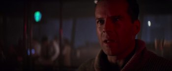 Movie still from “Die Hard 2” (1990), directed by Renny Harlin – A person wearing a sweater; Close Up shot, Low angle