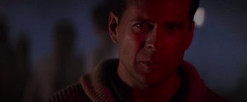 Movie still from “Die Hard 2” (1990), directed by Renny Harlin – A person looking at the camera; Close Up shot, Low angle